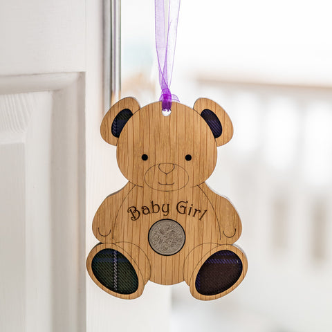 Wooden bear hanging ornament with baby girl written on the front.