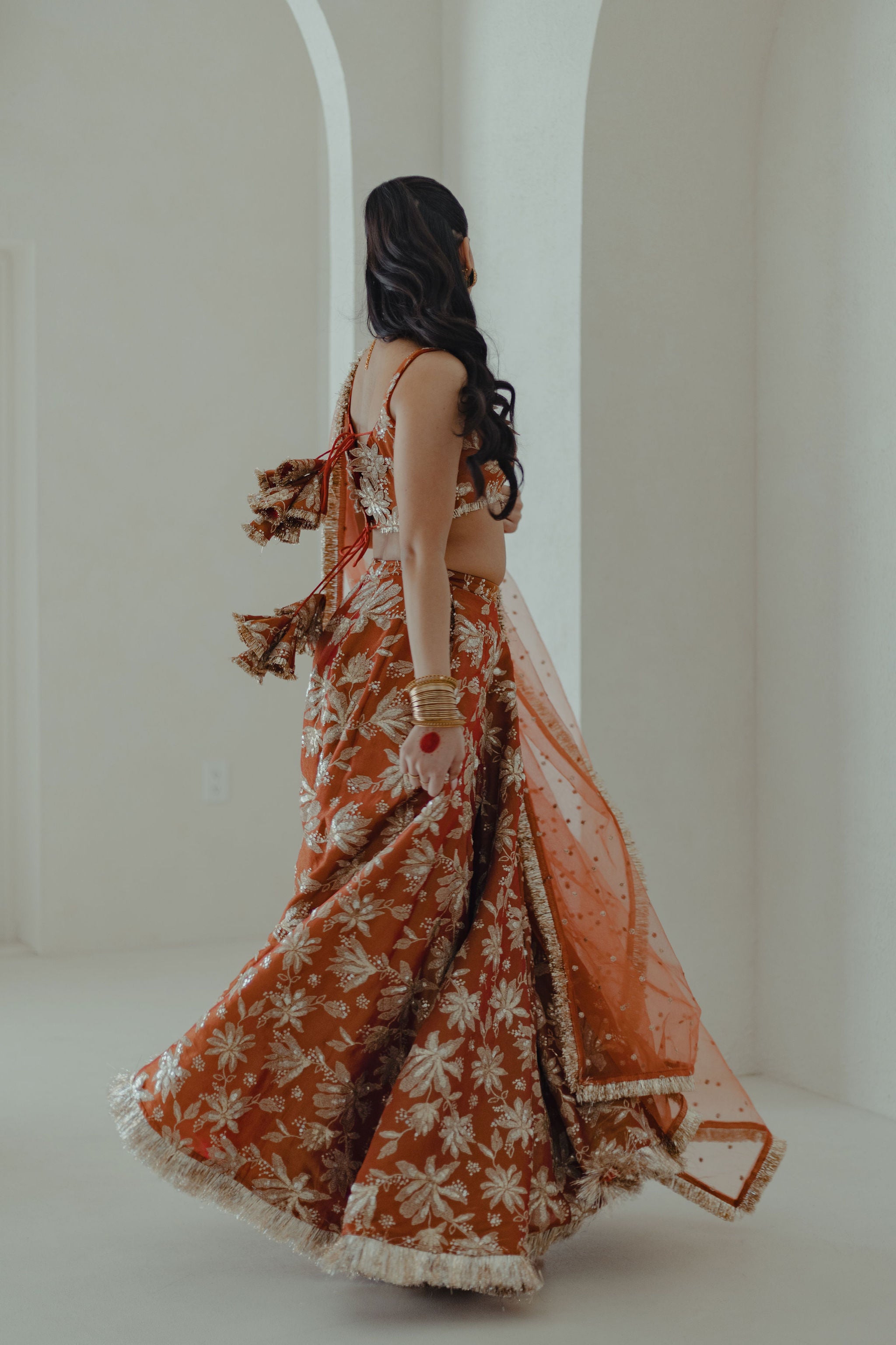 Jodha_lehenga_set_in_sunkissed_rust_twirl1_campaign