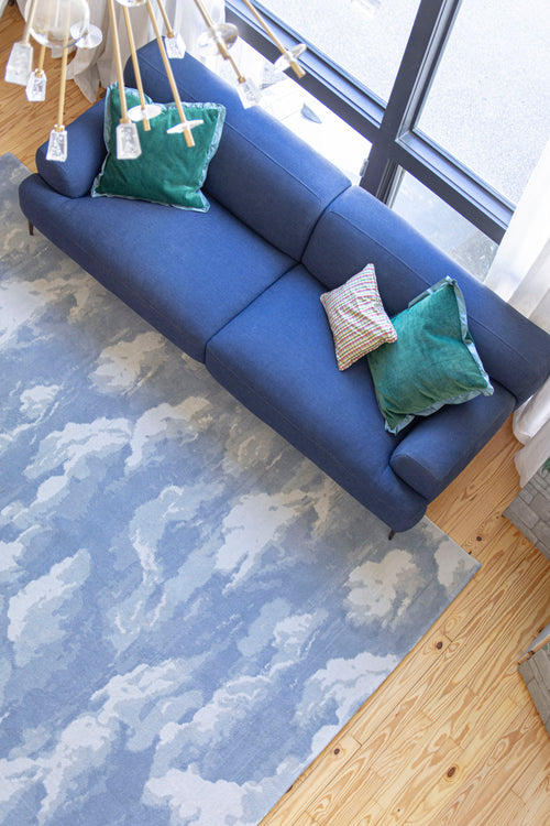 Cloud home decor inspiration featuring the Cumulus Cloud rug by Kevin Francis Design and cloud sofa dupe, cloud chair, wall art, and wallpaper on The Francis Files design blog