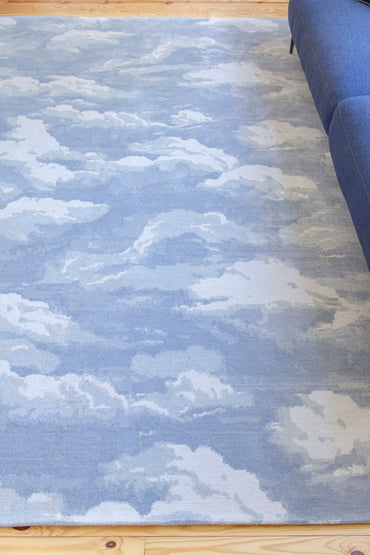 Cloud home decor inspiration featuring the Cumulus Cloud rug by Kevin Francis Design and cloud sofa dupe, cloud chair, wall art, and wallpaper on The Francis Files design blog