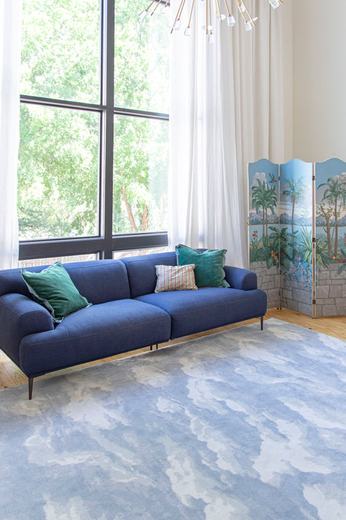 Cloud home decor inspiration featuring the Cumulus Cloud rug by Kevin Francis Design and cloud sofa dupe, cloud chair, wall art, and wallpaper on The Francis Files design blog