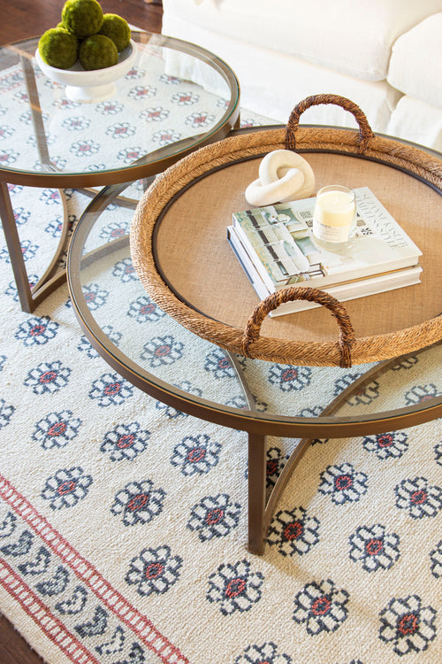 Classic living room design in Atlanta with Oka Opplyst nesting coffee table, velvet pillows, and floral rug on design blog The Francis Files by Kevin Francis O'Gara