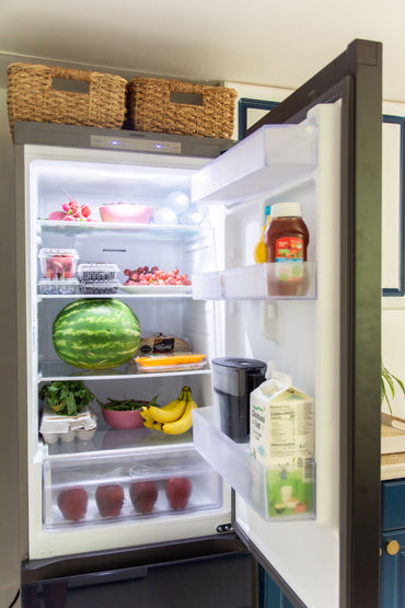 Navy blue glass Samsung Bespoke single column refrigerator inside view, kitchen makeover design in Atlanta