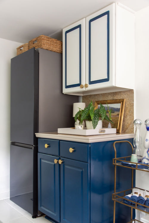 Navy blue kitchen makeover with Samsung Bespoke glass refrigerator review, Behr Nocturne cabinets, Repose Gray painted tile floor, cabinets with painted border