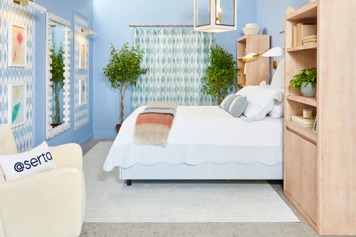Blue monochrome New Traditional style blue bedroom design by Kevin Francis O'Gara for Small/Cool NYC 2023, featuring Clare Cloud Watching blue paint, bust statue, striped bed, and bookcase by bed on The Francis Files design blog