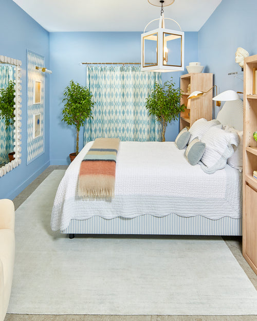 Blue monochrome New Traditional style blue bedroom design by Kevin Francis O'Gara for Small/Cool NYC 2023, featuring Clare Cloud Watching blue paint, bust statue, striped bed, and bookcase by bed on The Francis Files design blog