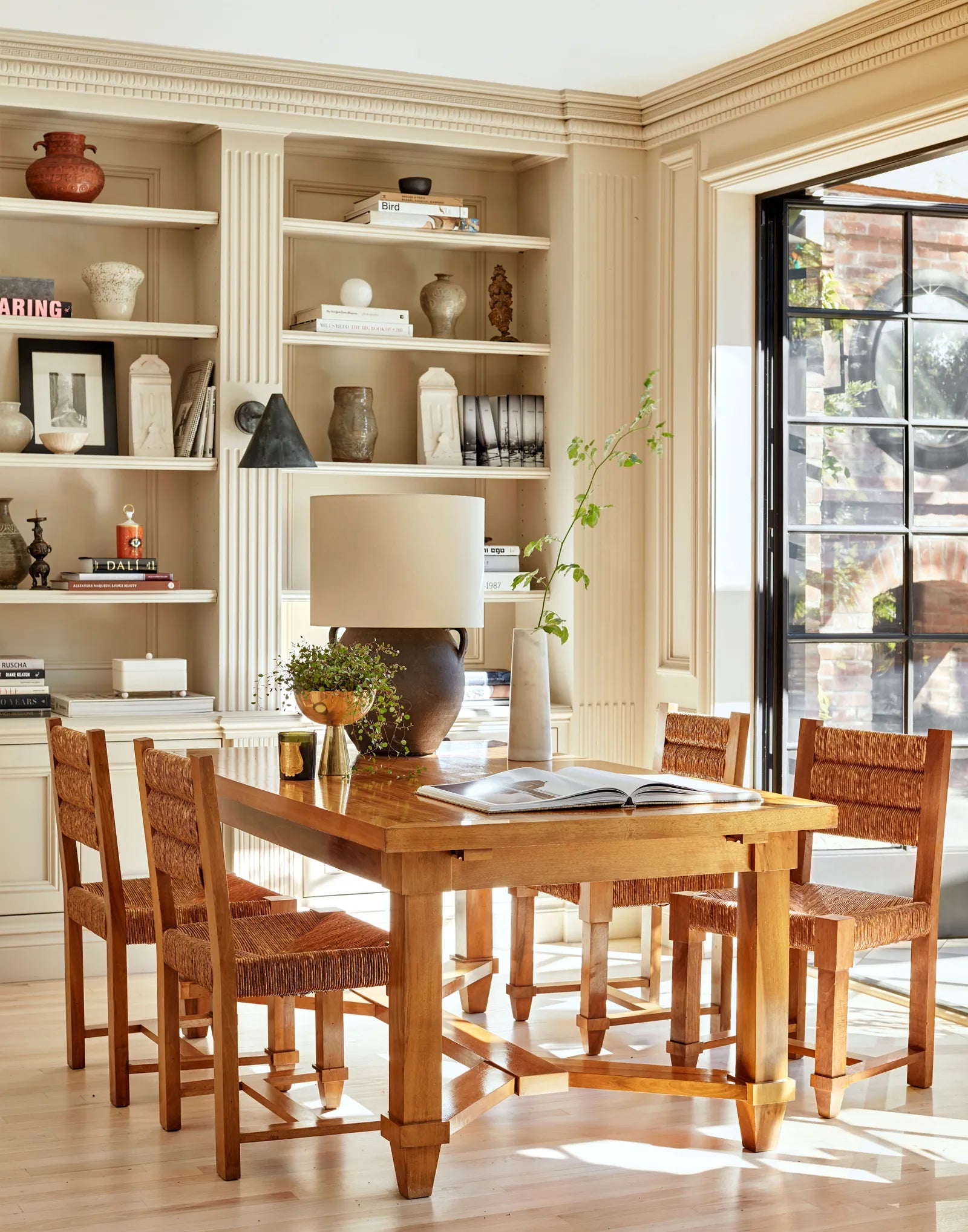 Los Angeles Tudor house design by Nate Berkus via Architectural Digest, with Jacques Adnet dining table and chairs, on Kevin Francis Design