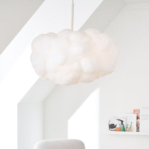 Cloud home decor inspiration featuring the Cumulus Cloud rug by Kevin Francis Design and cloud sofa dupe, cloud chair, wall art, and wallpaper on The Francis Files design blog