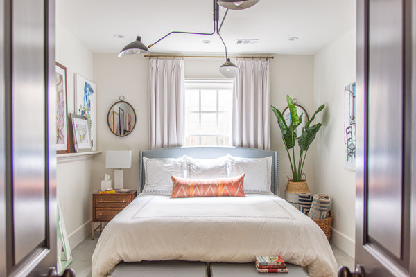 Bedroom design with modern light fixture by interior design consultant Kevin Francis in Atlanta