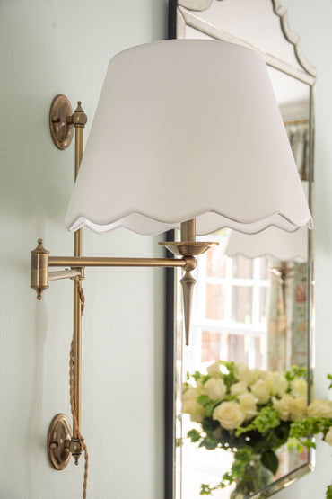 Ballard Designs Weatherford swing-arm plug in sconce with scalloped shade in dining room design by Atlanta interior design studio Kevin Francis Design