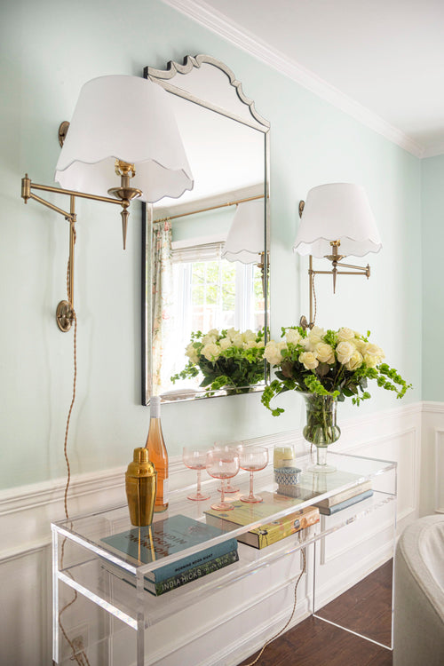 Modern classic dining room with gold chandelier, antique dining table, linen slipcover chairs, plug-in sconces, and Sherwin Williams Green Trance paint with chair rail wainscotting by Atlanta interior designer Kevin Francis O'Gara