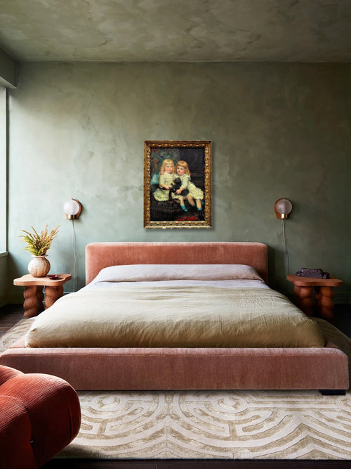 Green plaster walls, limewash bedroom design, minimal modern style, platform bed, antique painting, Kevin Francis Design Lucca circular maze area rug