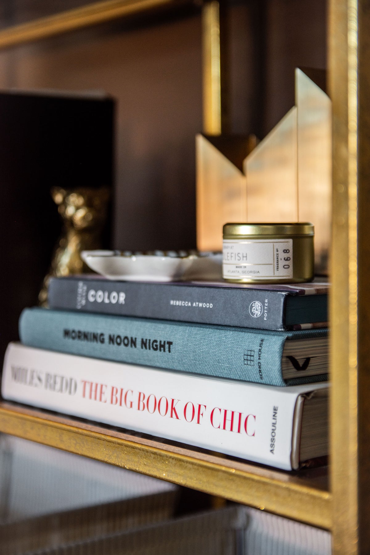 Dark brown paint in cozy living room media room design by Kevin Francis O'Gara, using Behr Dark Truffle paint, antelope rug, and cranes wallpaper