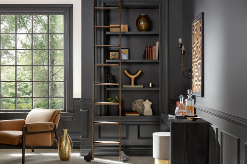 Sherwin Williams Iron Ore living room study design, bookshelf with ladder, dark gray wall paint, best charcoal paint color ideas on Kevin Francis Design