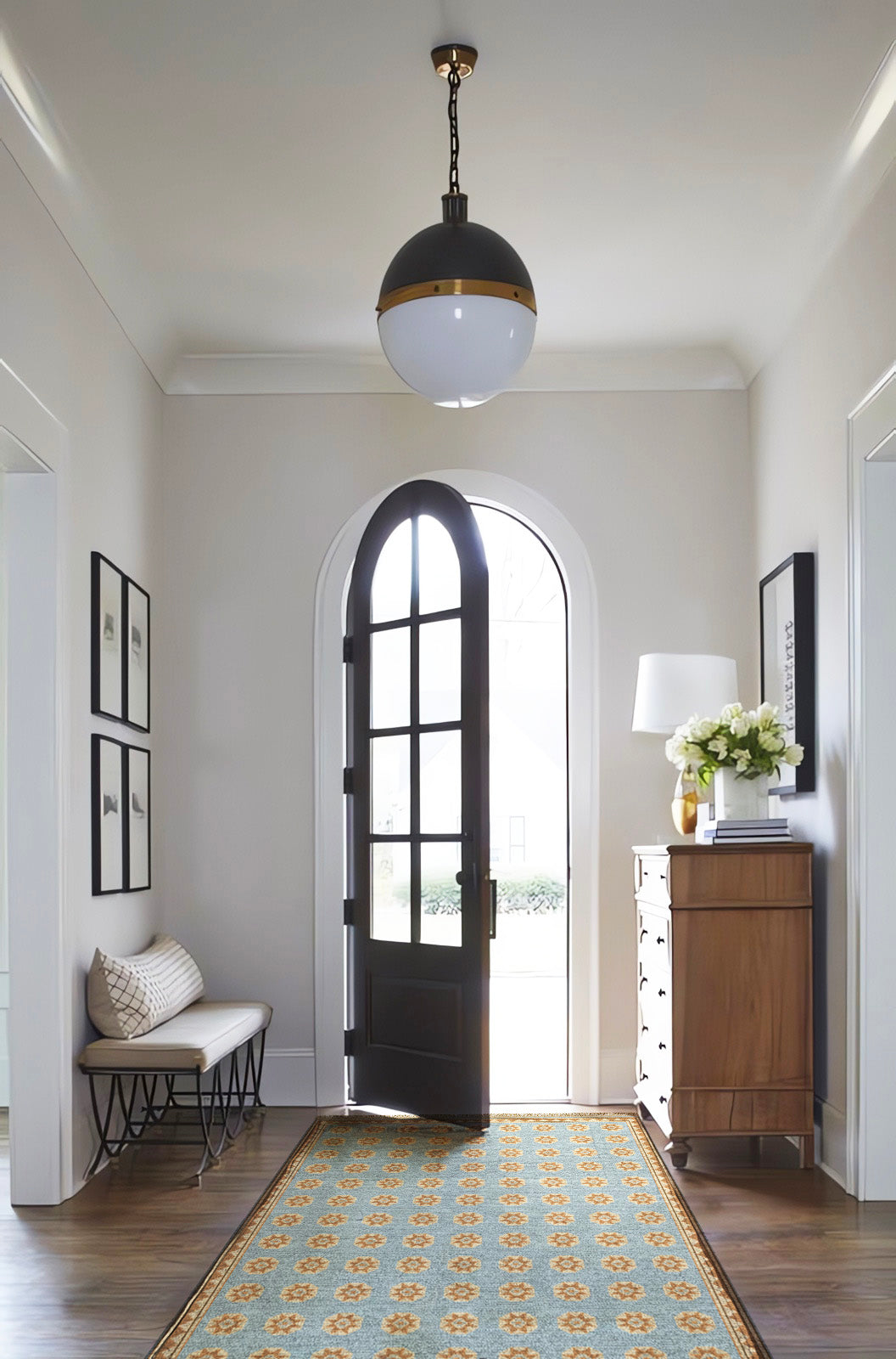 Classic entryway design with antique dresser, globe lantern light, blue hand-knotted Mamluk luxury area rug, entryway rugs, entry design ideas