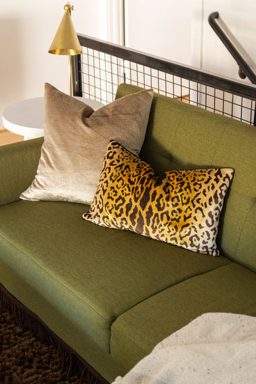 Media room loft design by Atlanta interior designer Kevin Francis O'Gara with the Queer Eye Kerswell futon, brown shag rug, and custom painting