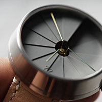 A closeup of the dimensional dial on a 22 Design watch