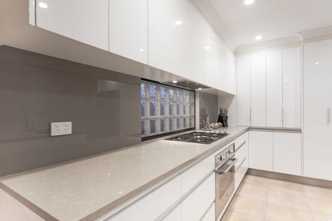 Grey glass backsplash tile in a contemporary kitchen