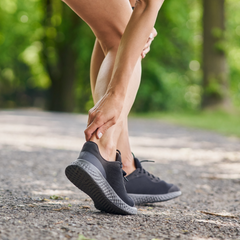 Achilles Tendinitis causing pain in a woman who is exercising foot