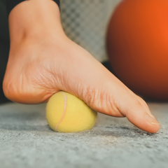 Stretching foot to help with chronic foot pain. 