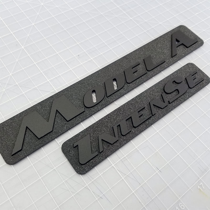 Custom matte black emblems