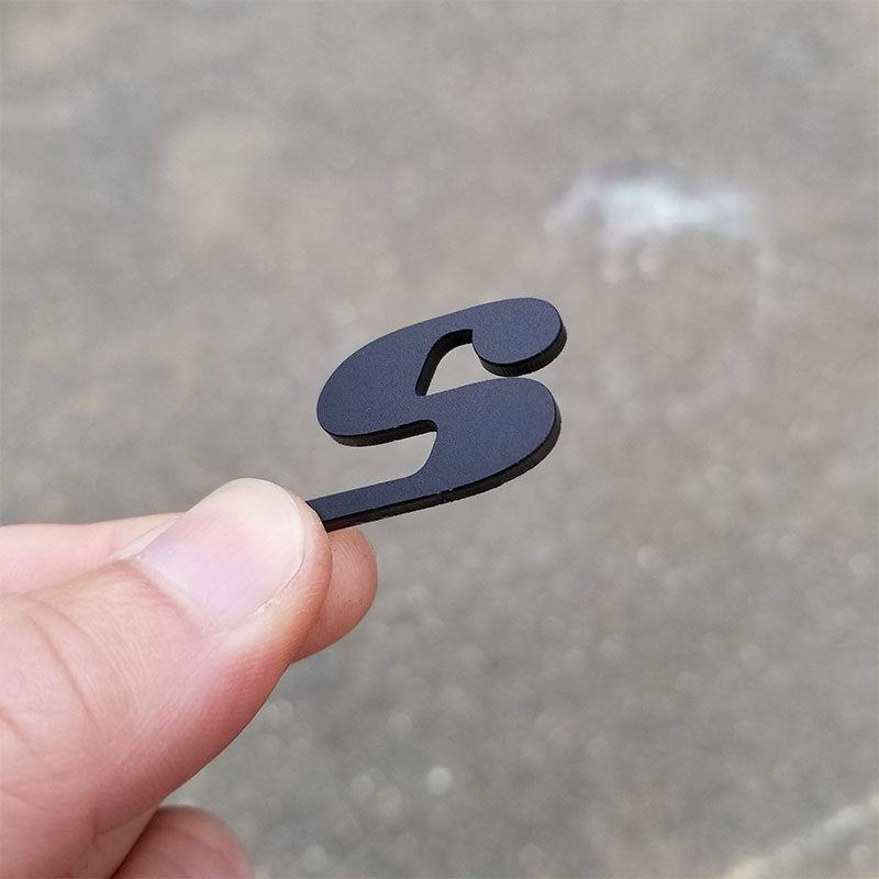 thick matte black car emblem