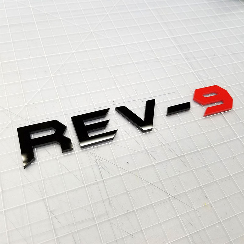 Emblème Rev-9