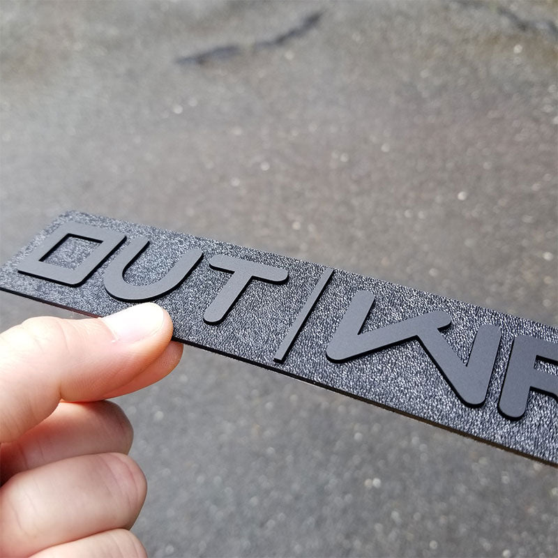 matte black and textured emblem