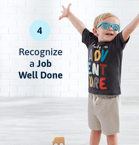 smiling toddler boy with hands up wearing shorts and t-shirt with sunglasses. overlayed text reads "recognize a job well done"