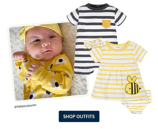 baby girl laying down in yellow outfit with matching headband