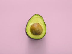 Avocado on pink background