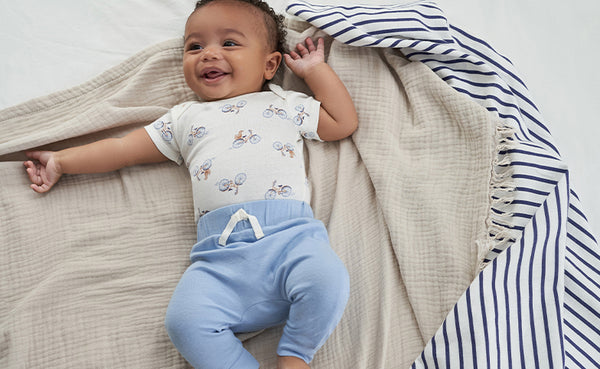 This little guy is all smiles in his comfy two-piece jammies.