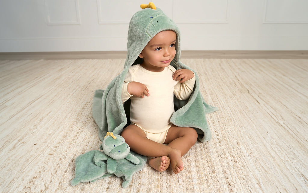 baby boy in dinosaur hooded robe