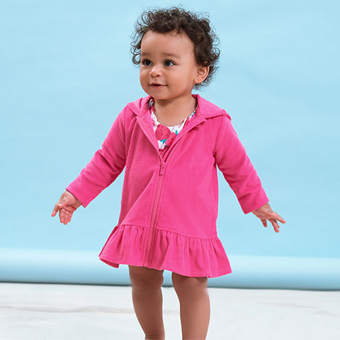 Baby girl standing in pink zipper hoodie swimsuit coverup