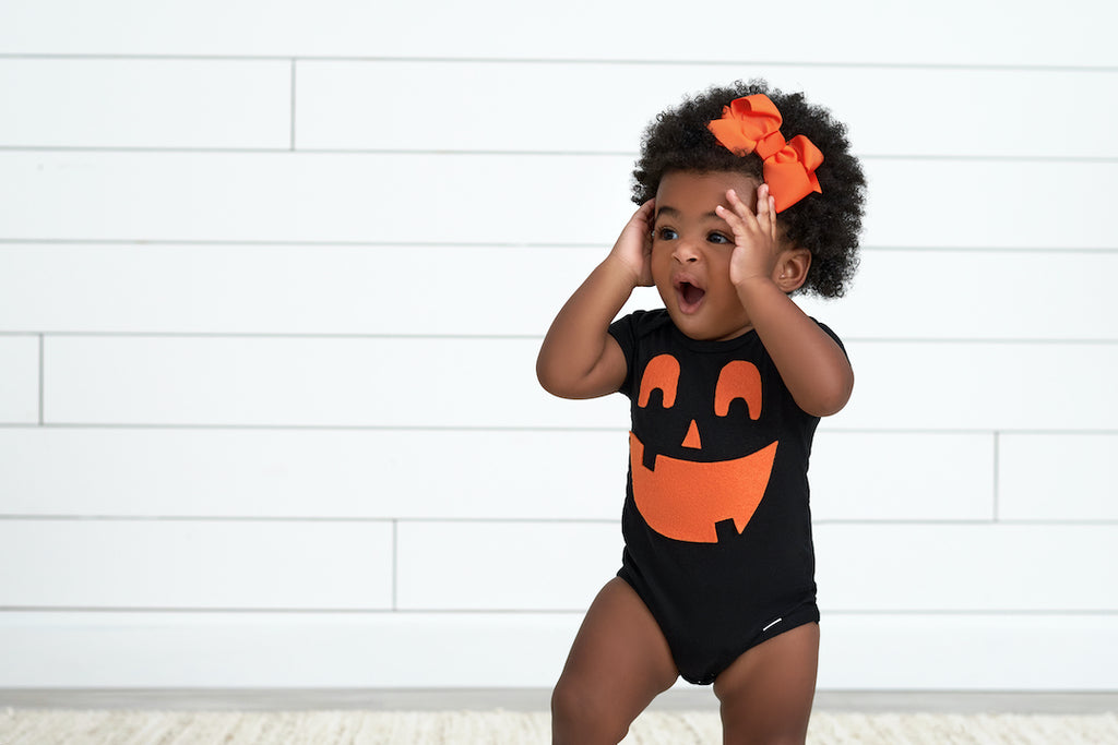 Baby Girl in Jack-O-Lantern DIY Halloween Costume Using a Black Onesies® Bodysuits