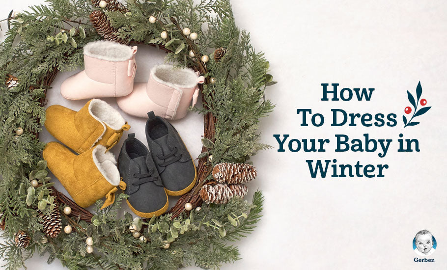 Three various baby shoes sitting in a pine winter wreath with words beside it saying "How To Dress Your Baby in Winter"
