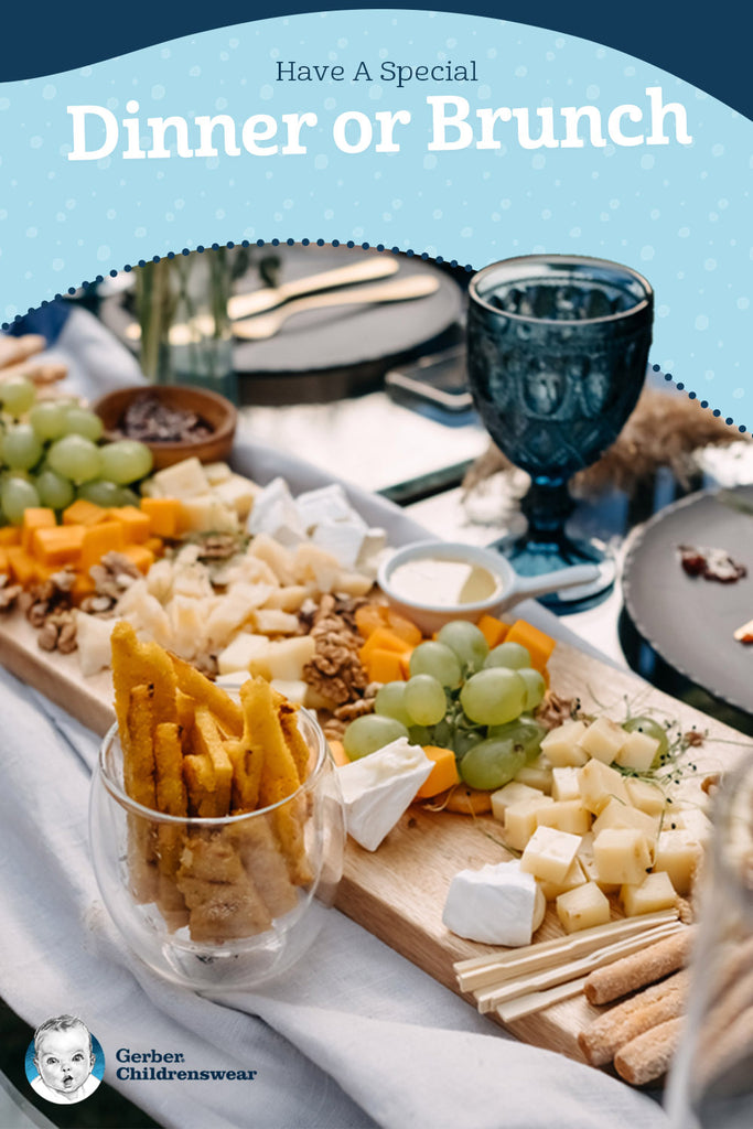 Photo of a tablescape with grapes and charcuterie board dining.