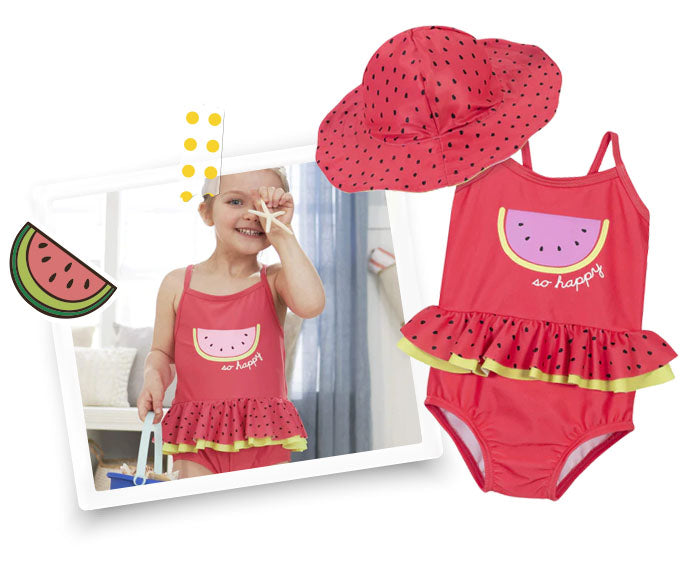 little girl holding starfish and wearing watermelon beach day toddler bathing suit set
