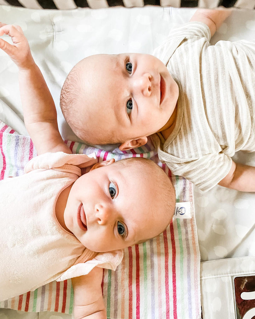 Twin cute sibling babies