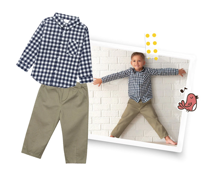 toddler boy wearing khaki pants and plaid shirt with arms spread wide, smiling for the camera