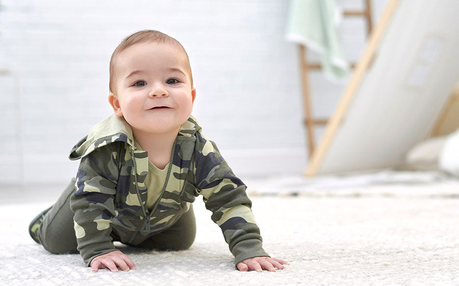 infant in camo hoodie