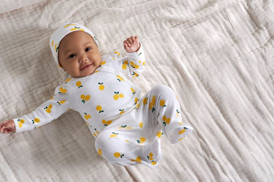 newborn in lemon outfit