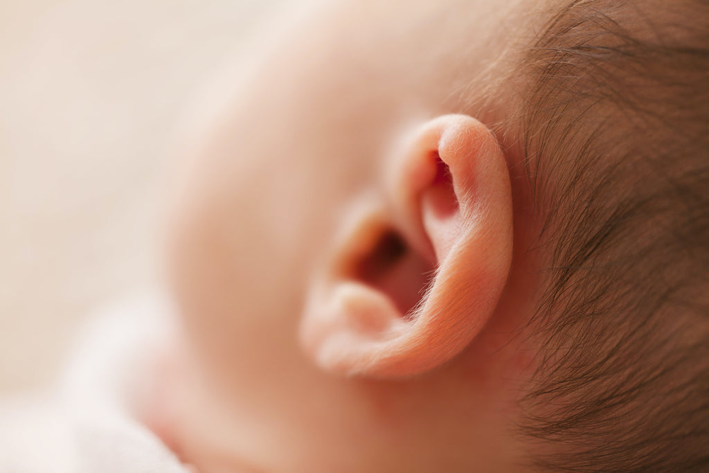 Zoomed in on a baby's ear, radiating innocence and purity.
