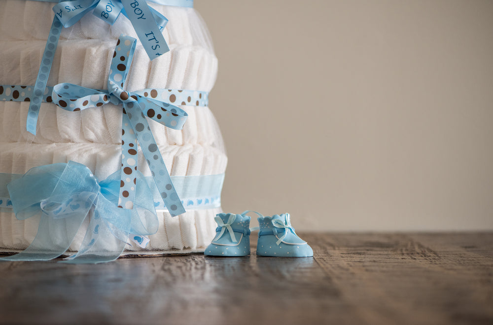 pile of diapers wrapped up in blue ribbon