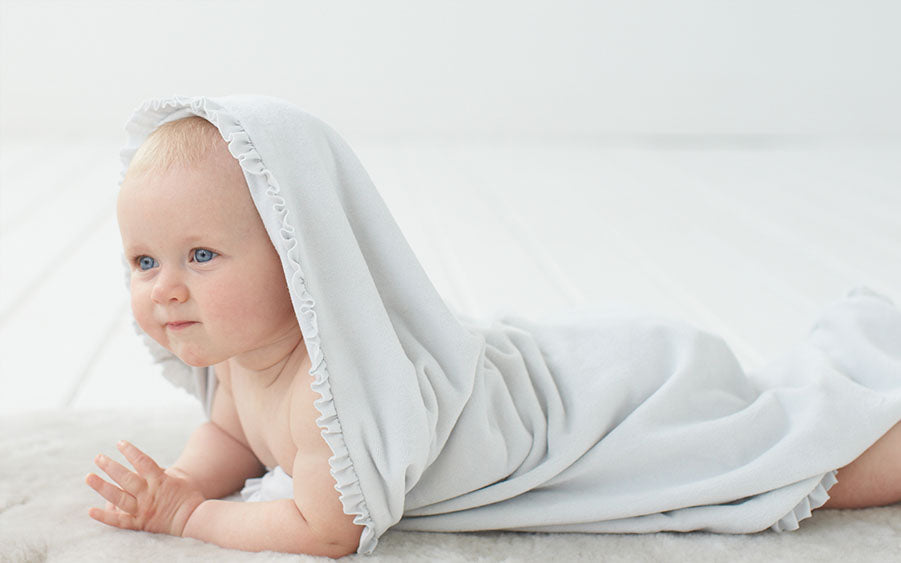 portrait of baby in blanket wrap