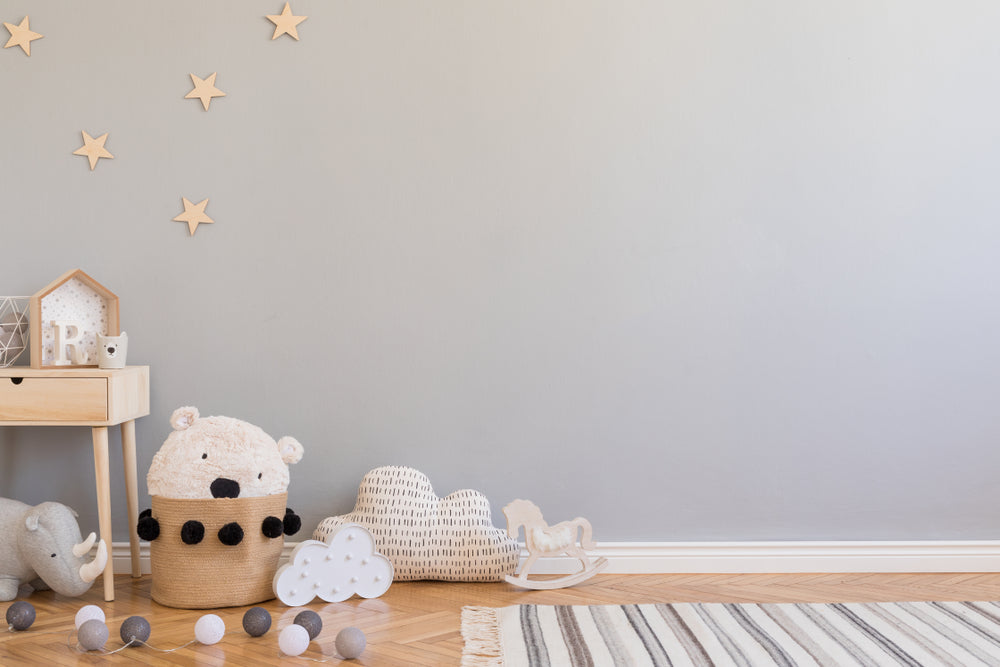 scandinavian newborn baby room with cloud and animal decorations