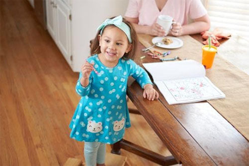 toddler wearing polka dot bear dress