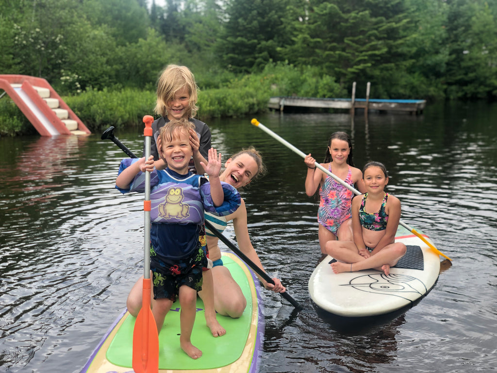 family summer playing in the water