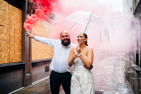 Rainy day wedding photo. Umbrella wedding photo