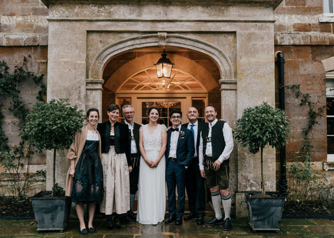 The couple and family in Bavarian dress outside Thorpe Manor